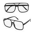 90s Hip Hop Glasses with Clear Lenses — A pair of small oval nineties-style glasses with slim black frames and clear lenses.