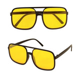 90s Hip Hop Glasses with Yellow Lenses — A pair of small oval nineties-style glasses with slim frames and yellow tinted lenses.