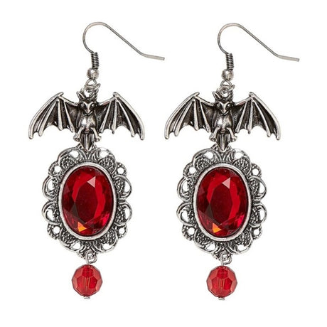 Bat Earrings with Red Gems — A pair of metal bats with wings spread, each set with a small red faceted stone.