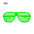 Neon Green Shutter Glasses — A pair of neon green shutter glasses with horizontal slats across the front instead of lenses.