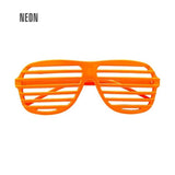 Neon Orange Shutter Glasses — A pair of neon orange shutter glasses with horizontal slats across the front in place of lenses.