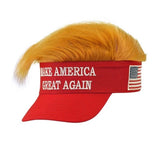 Novelty Slogan Visor with Plush Hair — A red slogan visor with a curved peak and a swept blond plush fringe attached along the top edge.
