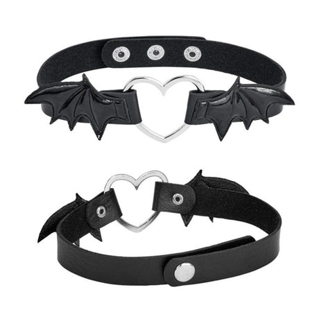 Winged Heart Choker — A black faux-leather choker band with a small heart pendant framed by a pair of bat wings.
